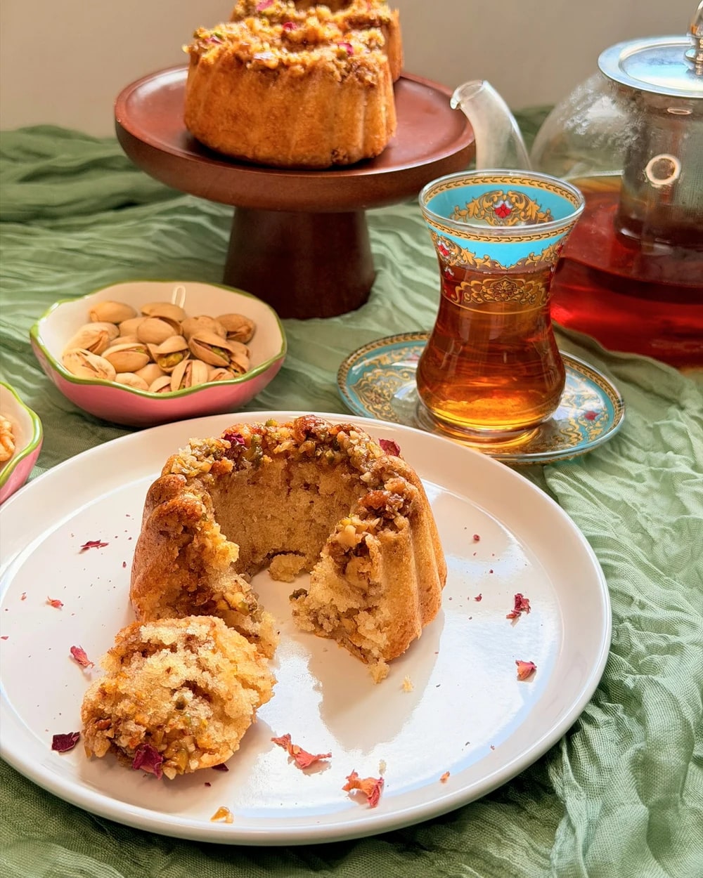Finished nut-topped bundt cakes served with tea