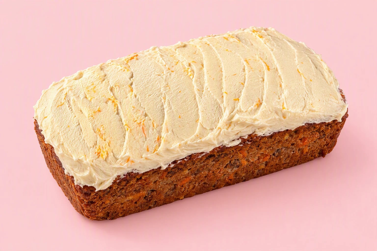 Joyful Bakehouse carrot cake loaf with a hand-spread cream topping