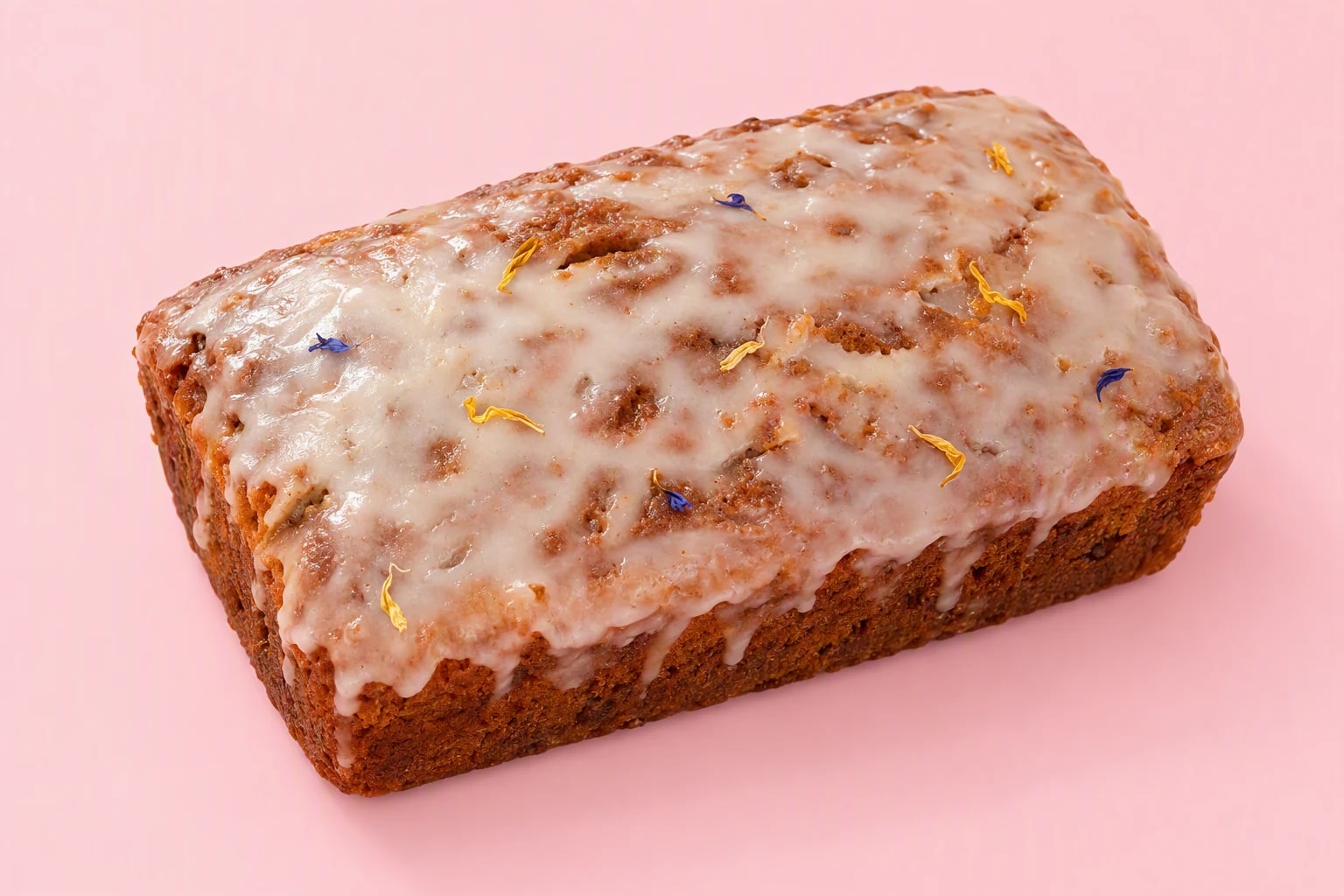 Joyful Bakehouse lemon drizzle loaf with sugar glaze and flower-petal decoration